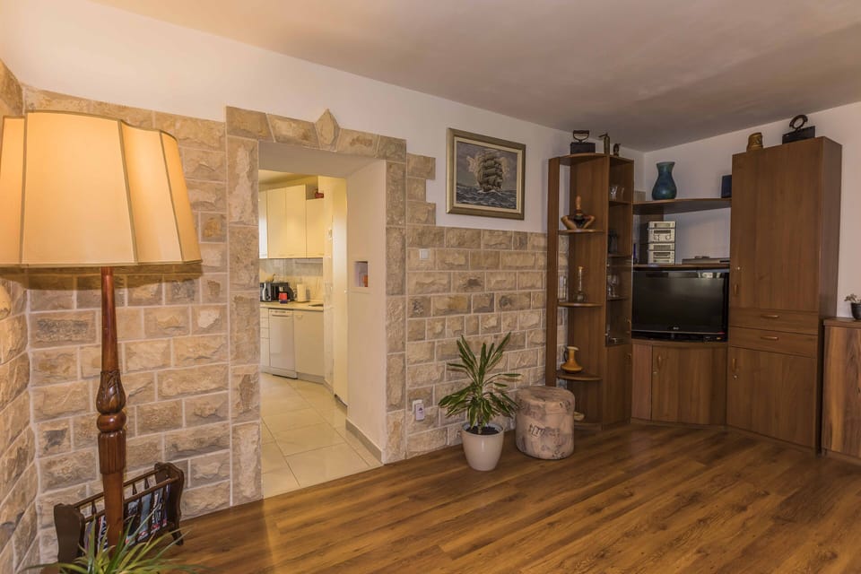 Renovated living room with a look to kitchen