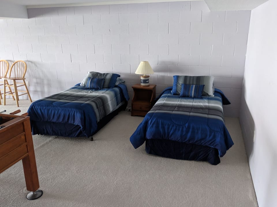 Twin beds in gameroom
