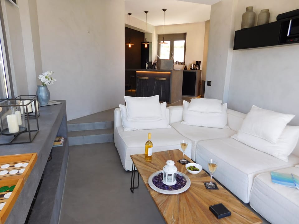 Boutique House sunken living room and steps to the kitchen.
