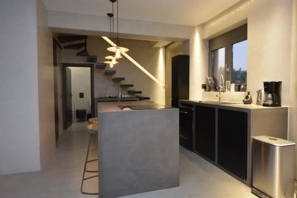Boutique House kitchen and door to the downstairs shower room.