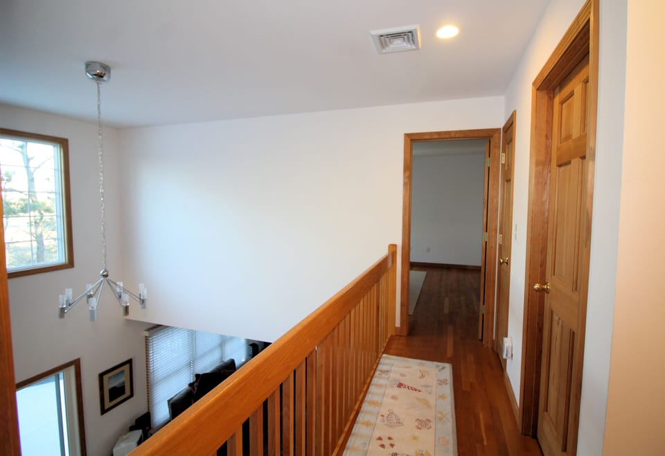 Second floor hall is open to first floor