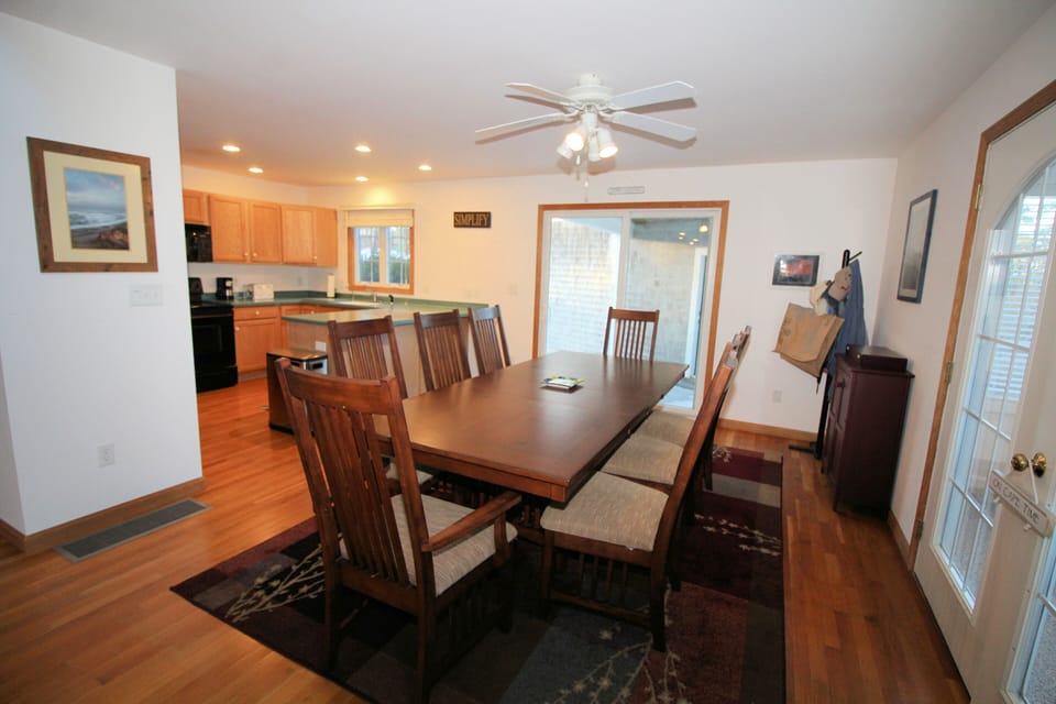 Dining area off kitchen with slider to deck