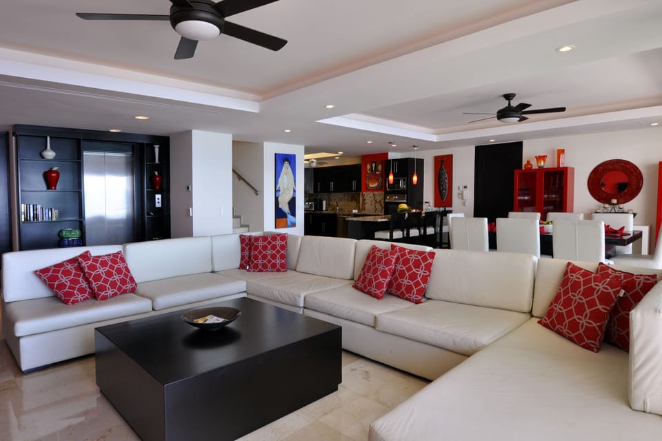 View of elevator and living, dining and kitchen areas