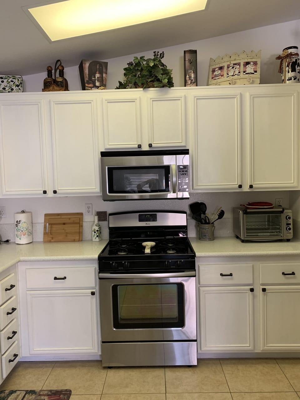 Kitchen - Microwave and gas stove/oven.

