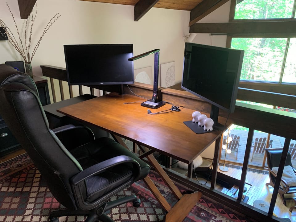 Open office space with 2 monitors and USB/USB-C/HDMI/VGA adapter