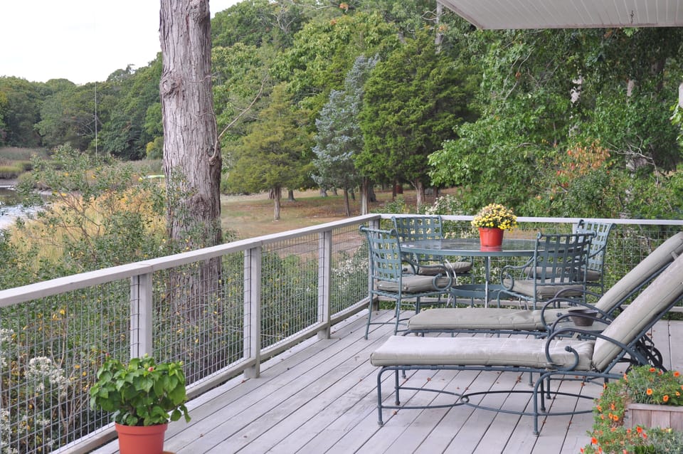 The al fresco life! 600 sq. ft deck, space for lounging, dining and entertaining