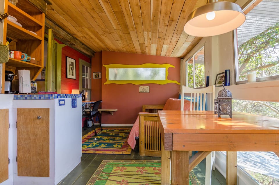Casita Roja - kitchenette (left), table, and futon