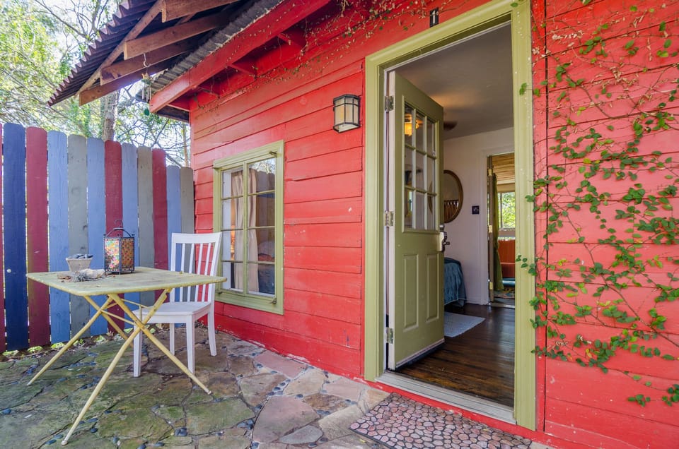 Casita Roja - outside entrance to the bedroom, stone patio & table