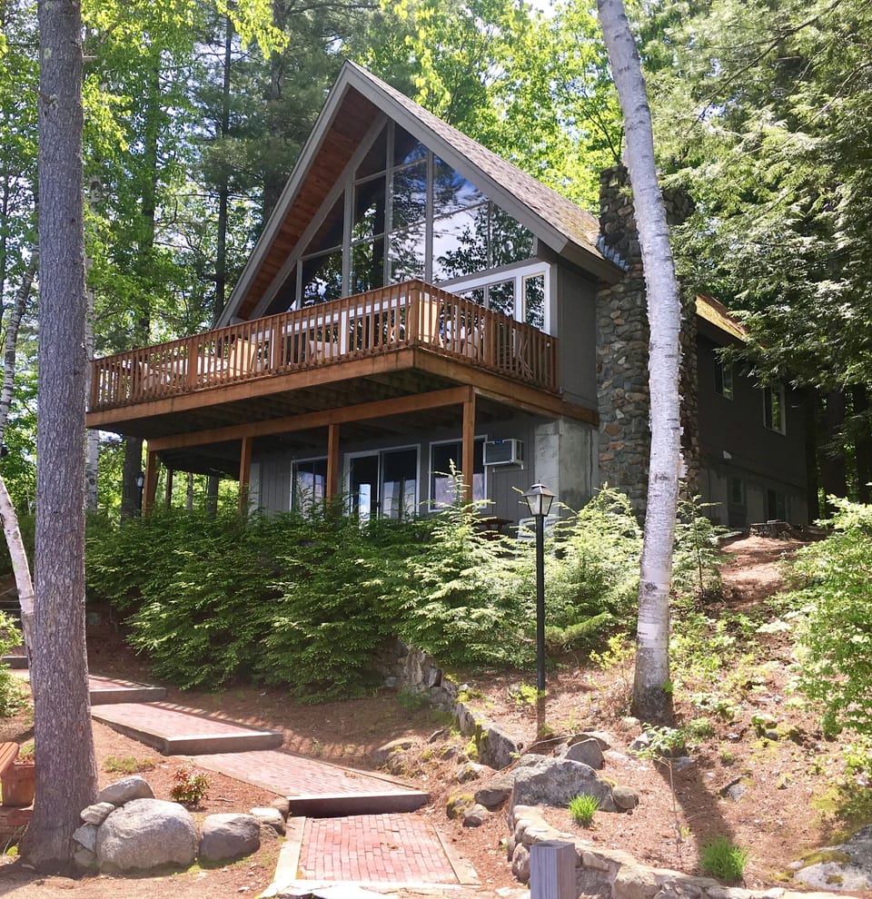 Front of home with spacious deck - looking up from dock