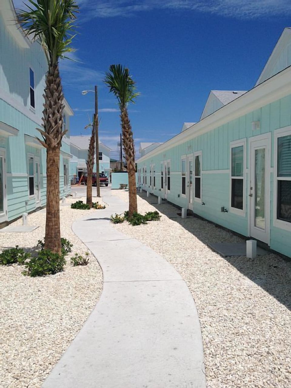 Sidewalk behind unit leads to pool