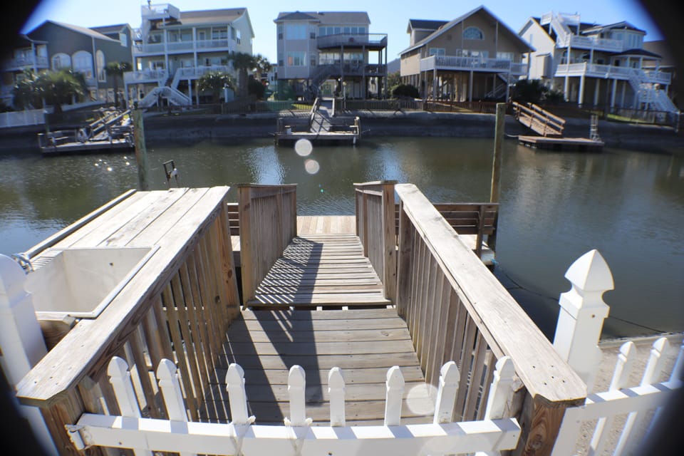 Walkway to private dock.Fish station. Canal boat navigable all tide levels.
