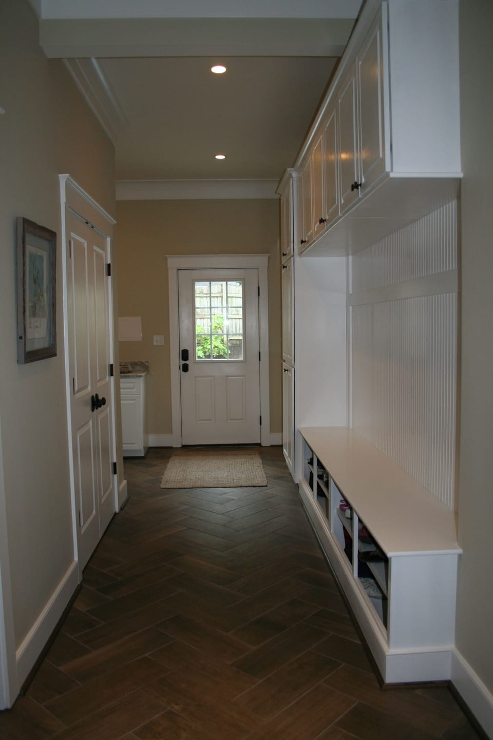 mud room and laundry room around the corner