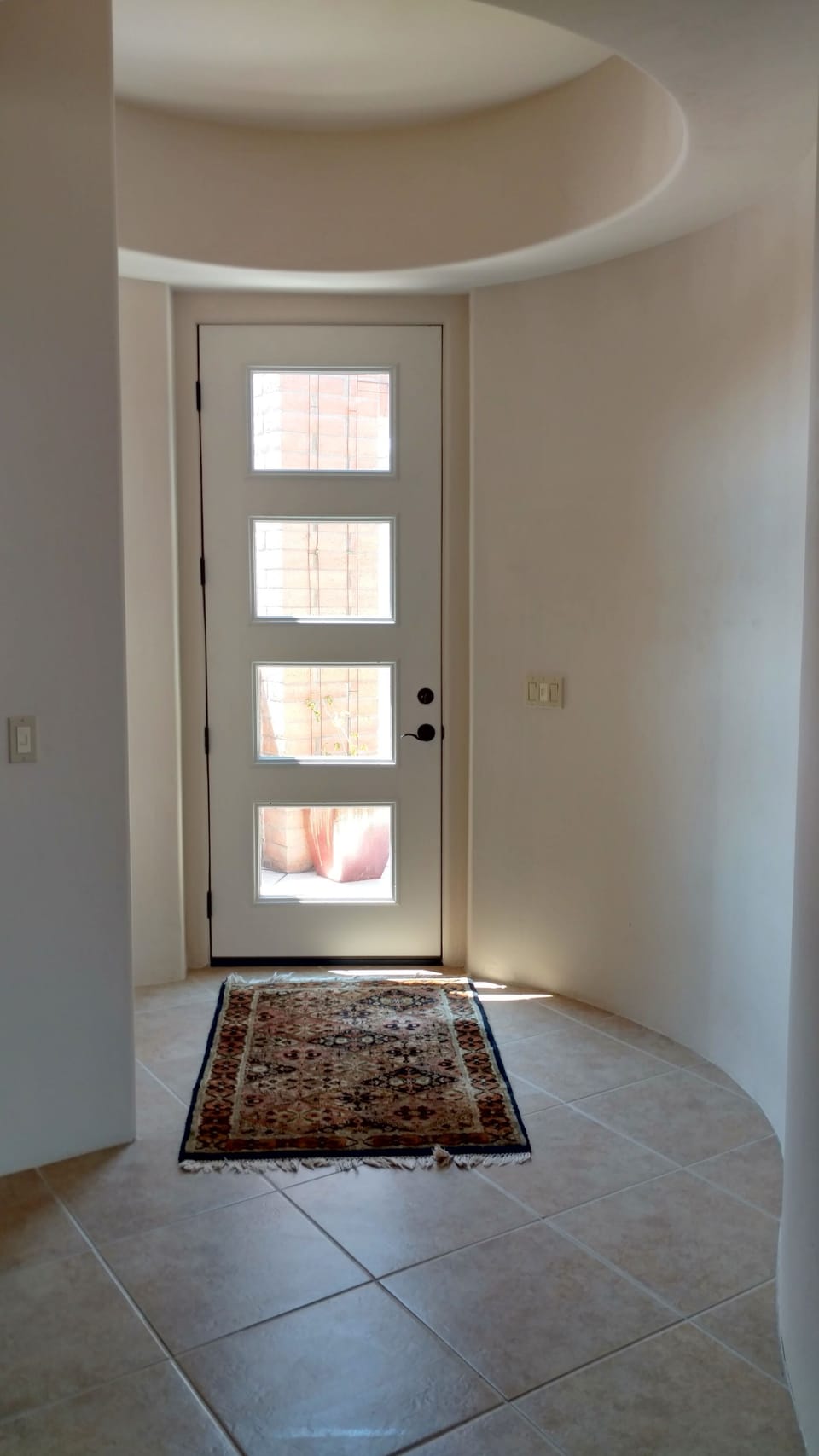entrance, see curved walls and architectural details of ceilings throughout