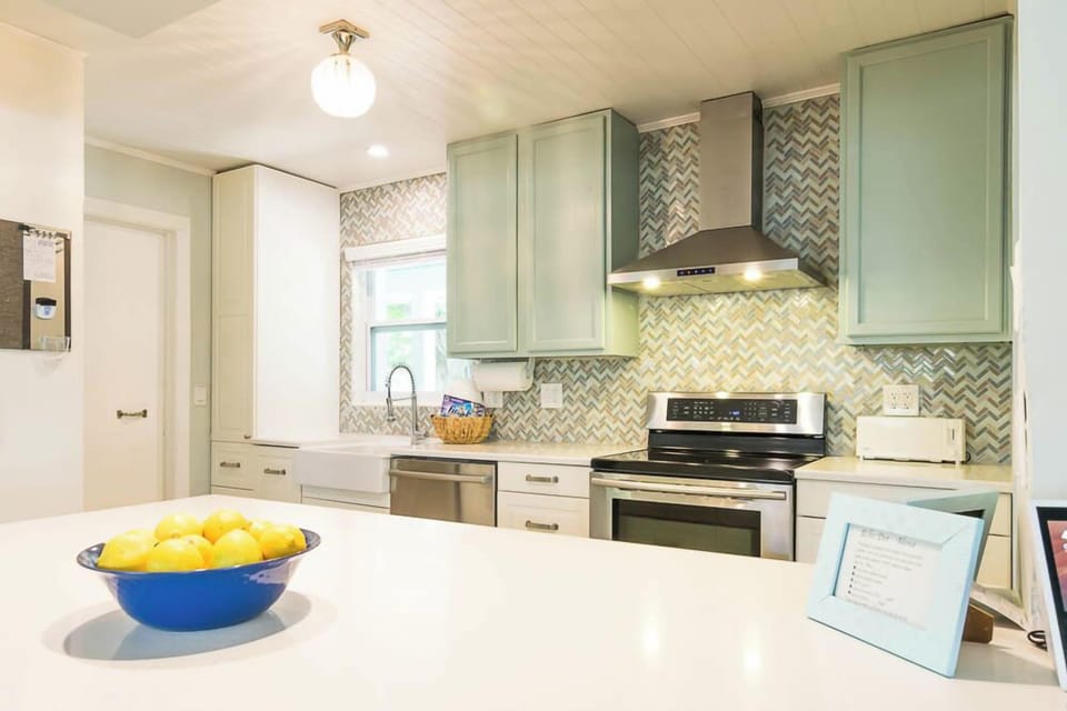 Well equipped kitchen with open counter seating.
