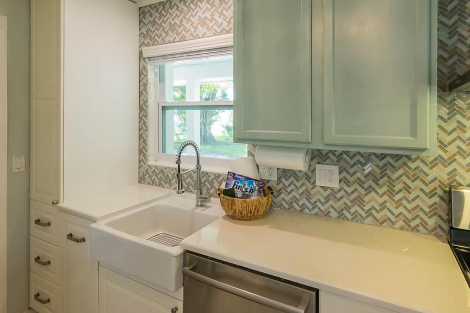 Lots of cabinets, conveniently designed kitchen.