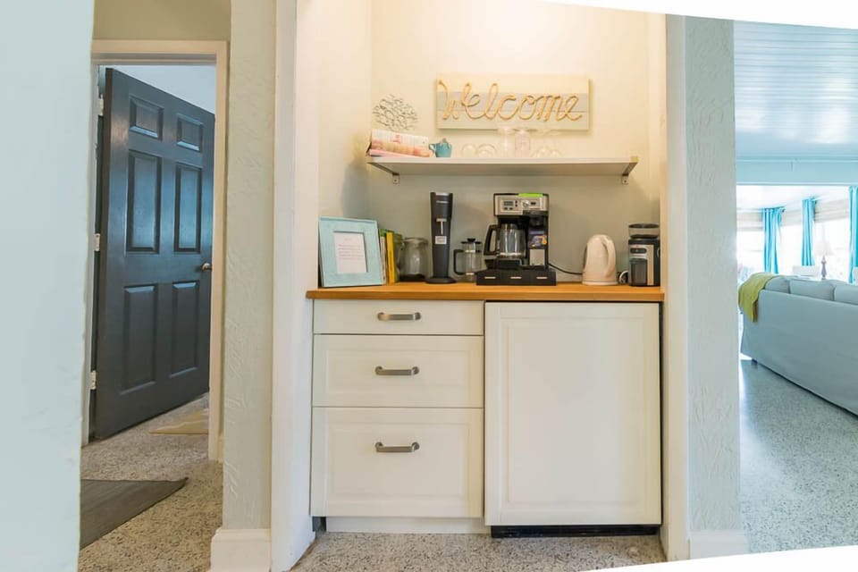 bar and coffee area with under cabinet fridge