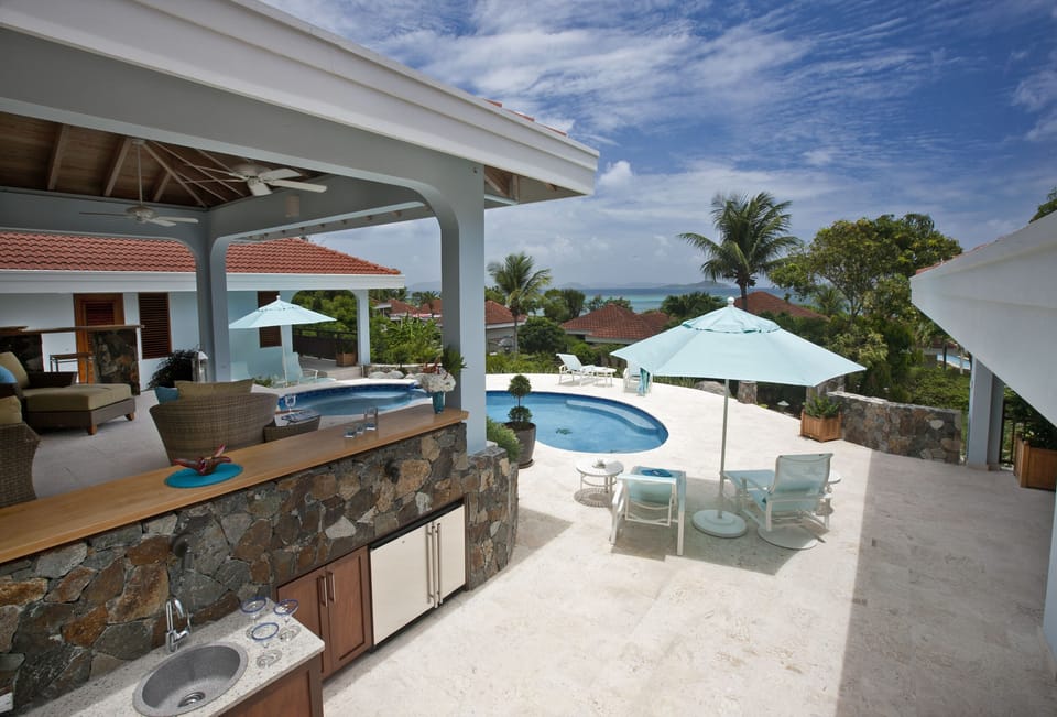An outdoor wet bar, refrigerator & crystal ice maker for your outdoor comfort.