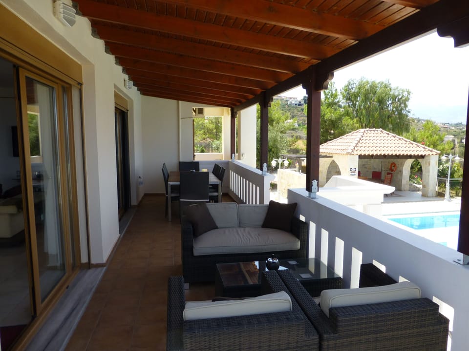 Lounge terrace and steps to pool area.