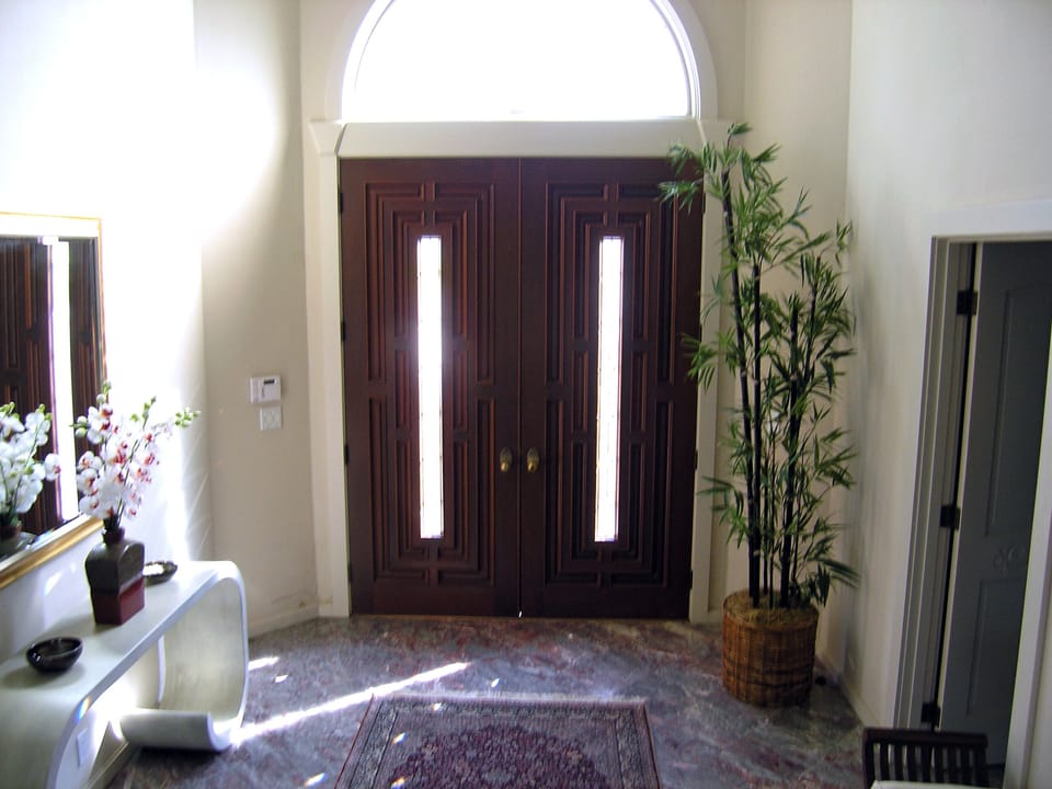 Main entryway - interior view, with marble floor and silk carpet.
