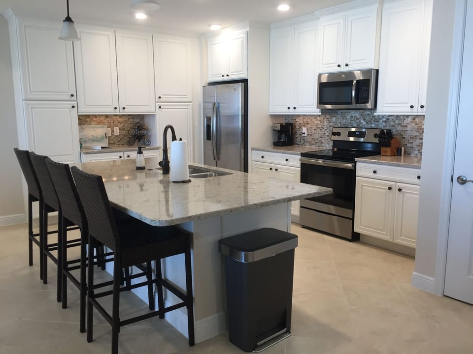 Well stocked kitchen with brand new stainless appliances