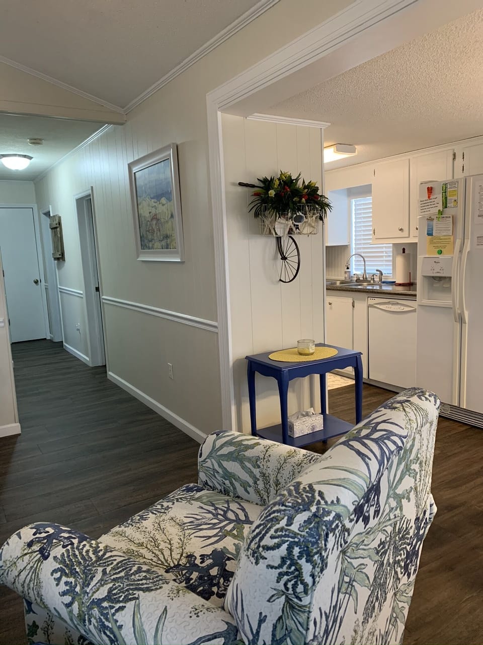 Entry area view - to the left, queen pull-out sleeper sofa and kitchen to tright