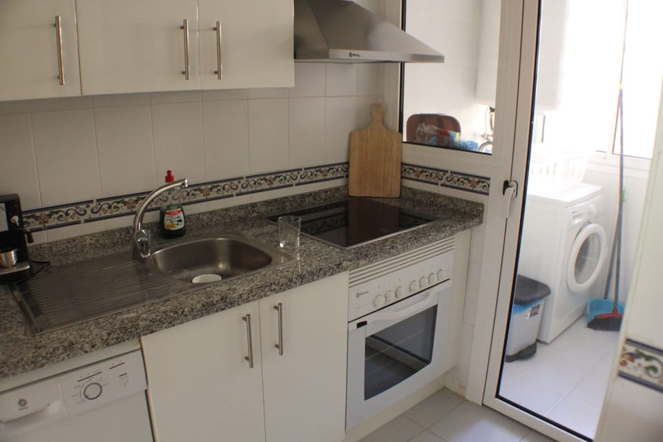 Kitchen showing cooker and dishwasher