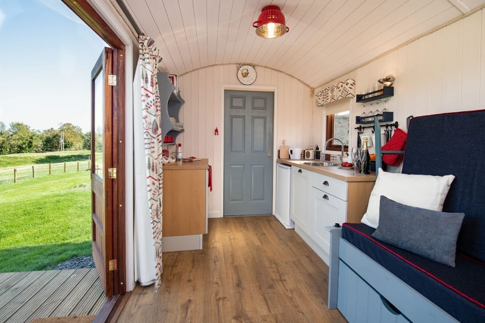 Foxglove - kitchen area and door leading into bathroom