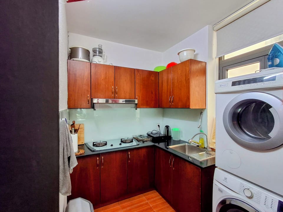 Kitchen with washing machine and dryer
