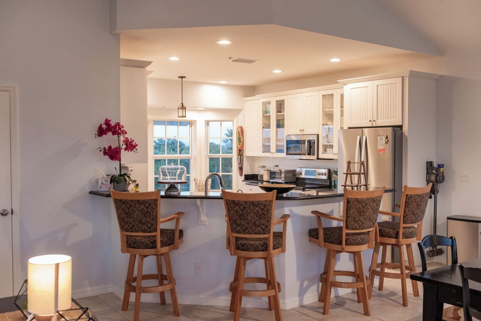 Large Bar with Seating Attached to Chef's Kitchen