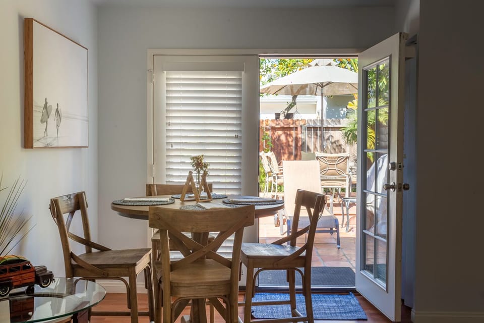 Family room with access to a fenced backyard and outdoor kitchen