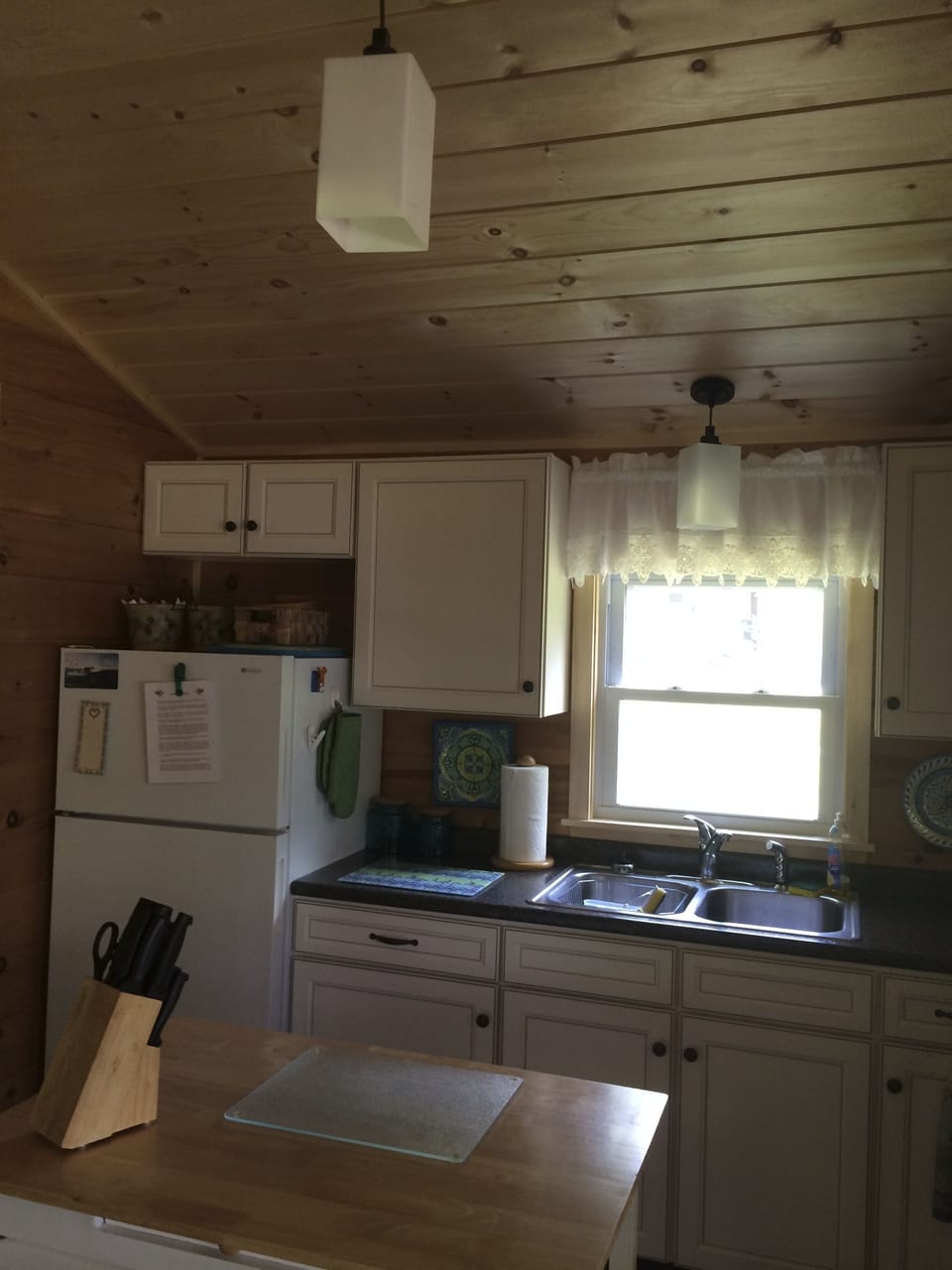 Another view of the kitchen with cathedral ceilings