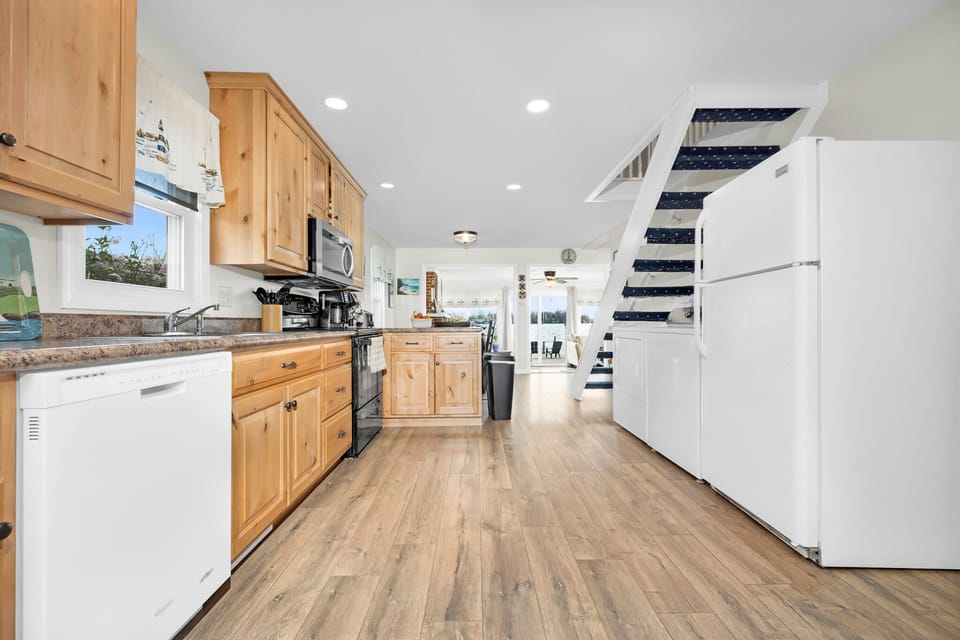 Open kitchen concept, with fully stock dishes, cutlery, pots / pans ect. 