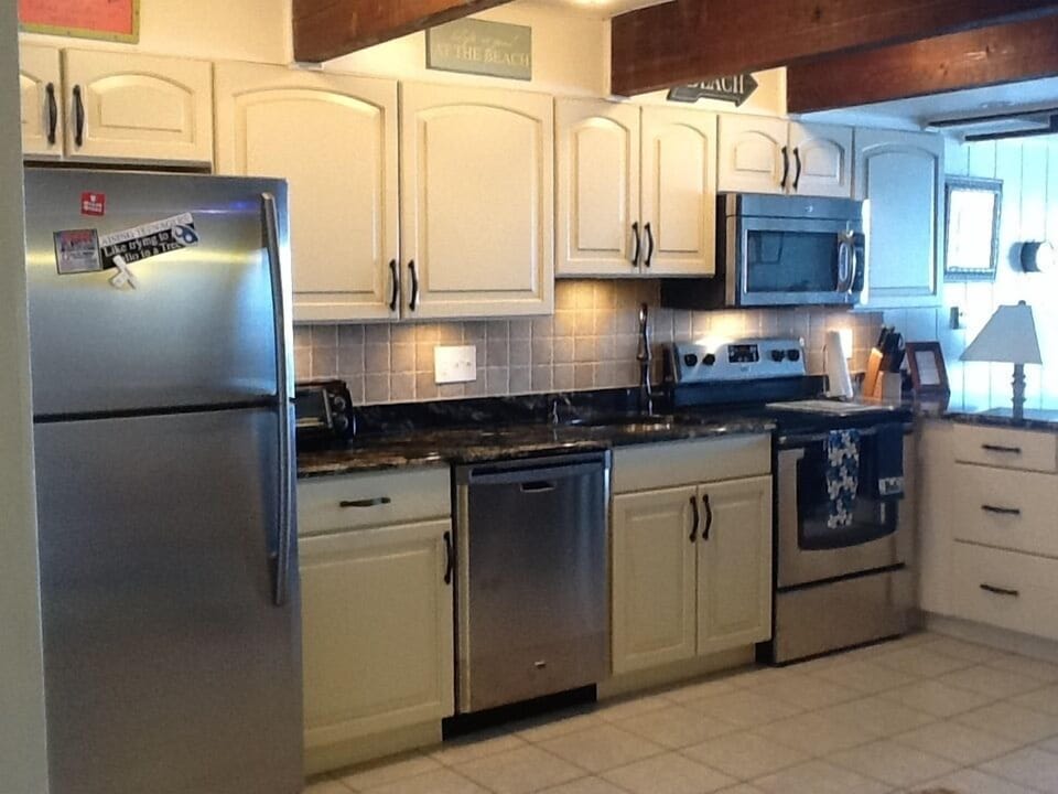 Kitchen - Stainless steel appliances, granite countertops, & 2 refrigerators