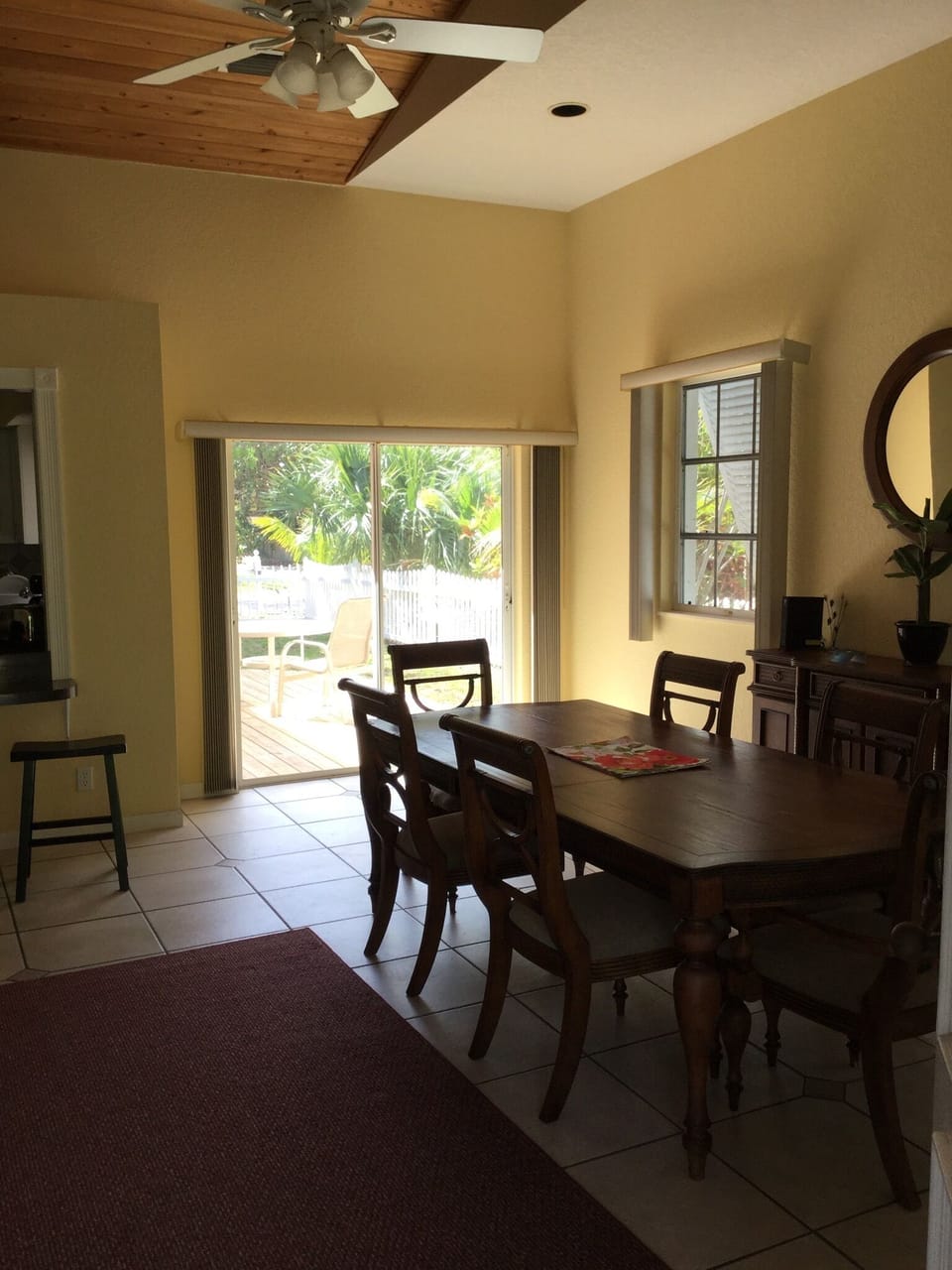 Dining table for 6 and patio door to side deck