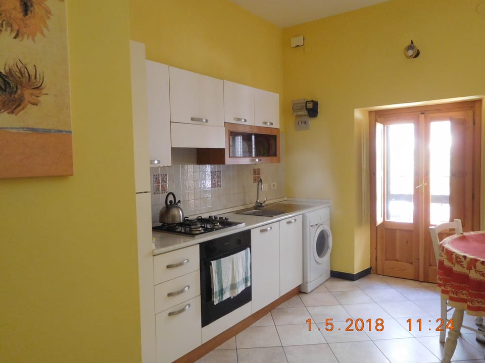 Kitchen area showing the patio to the private terrace.