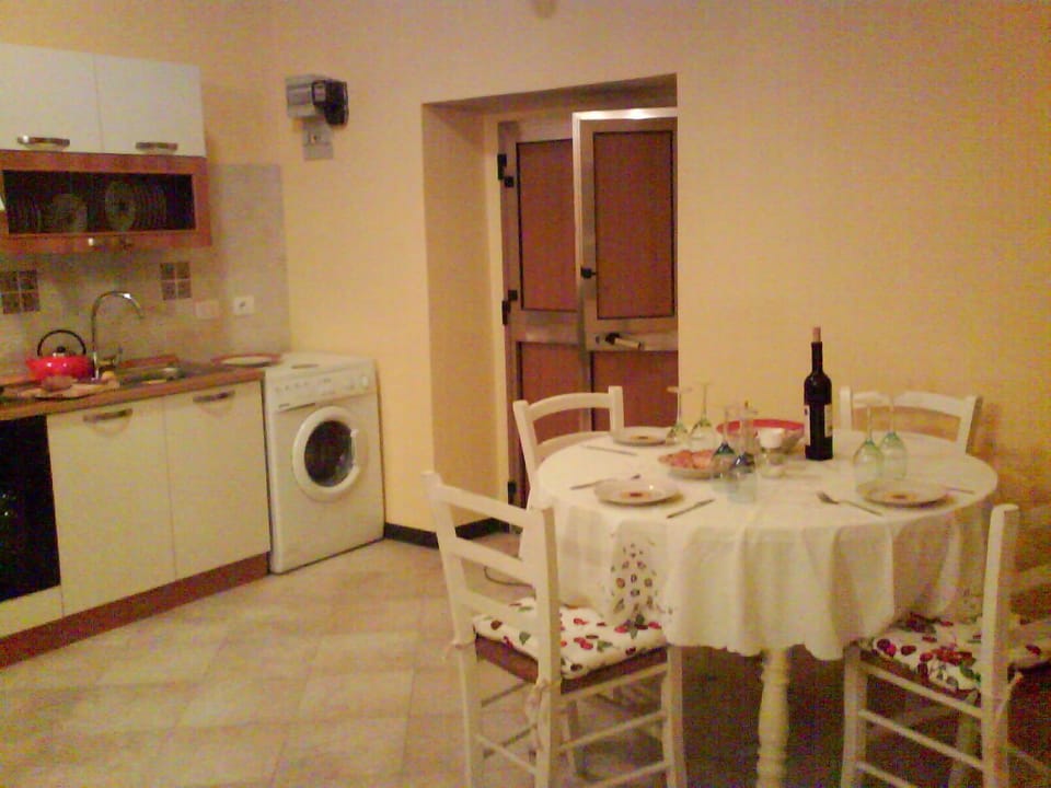 Dining area with the table laid for dinner.