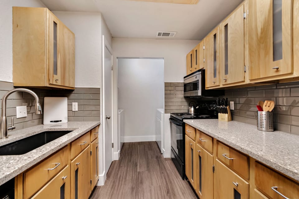 View of kitchen looking towards laundry room
Full size washer and dryer provided