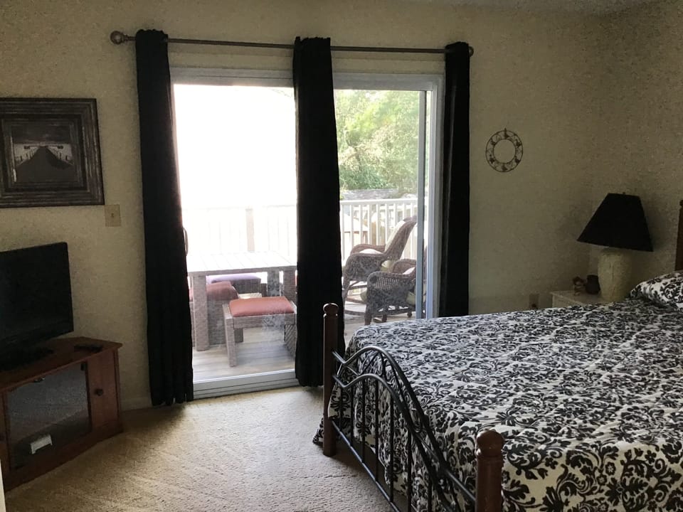Loft queen bedroom with covered porch