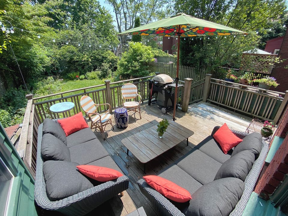 Deck overlooking garden - Gas grill makes for many an easy summer meal outdoors