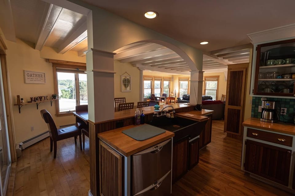 Open plan kitchen, dining, and livingroom areas to gather loved ones together