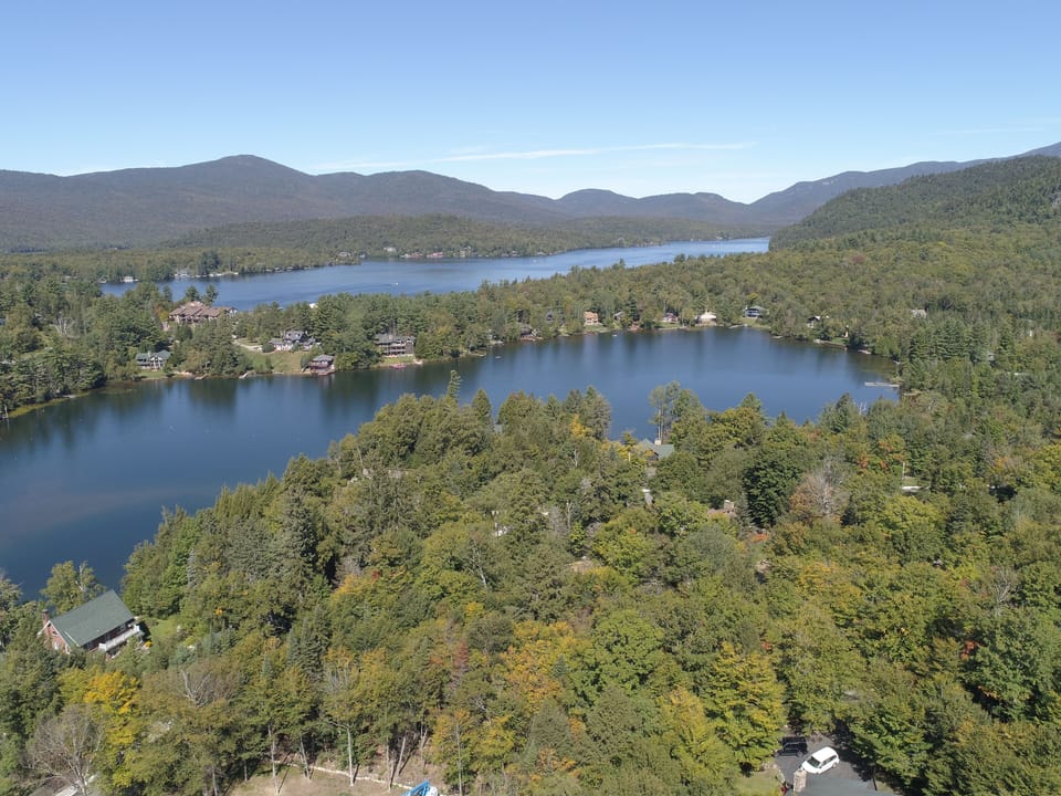 Birds eye view of Mirror Lake with Lake Placid and Whiteface in the background. 