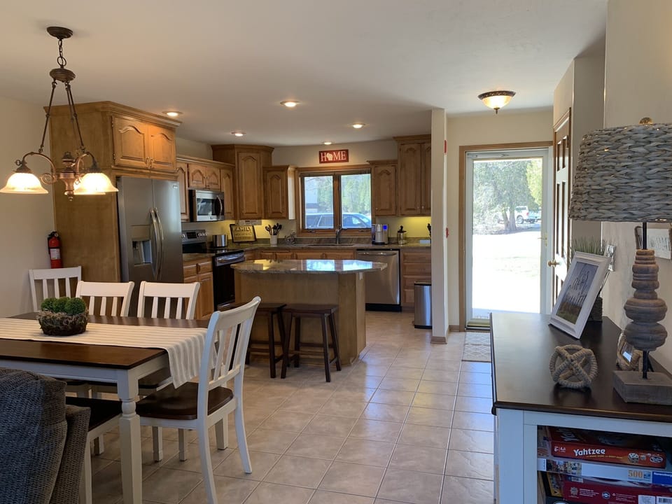 Kitchen has granite counters, nice island & brand new appliances.