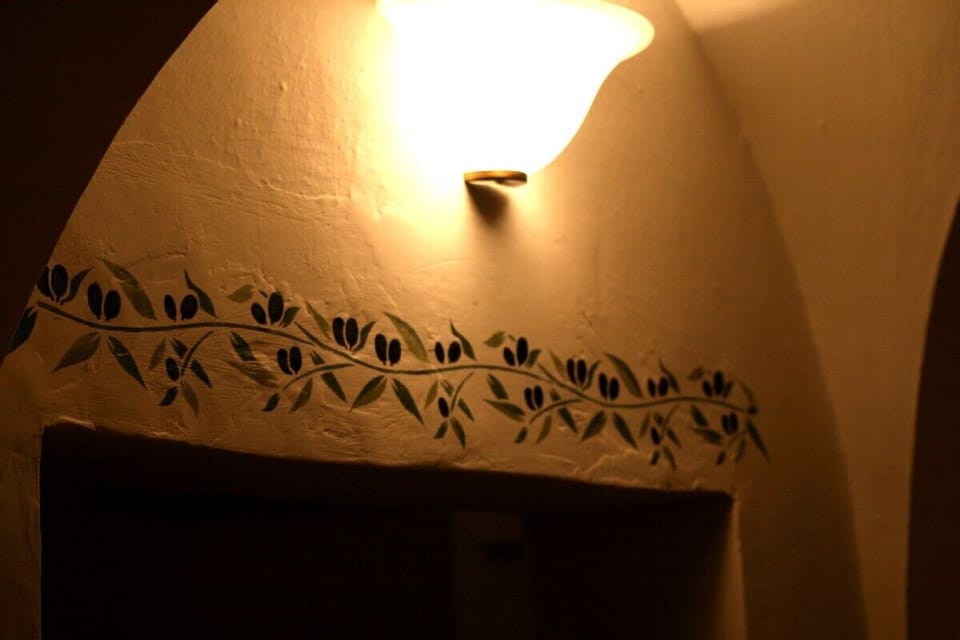 Olive stencilling in kitchen