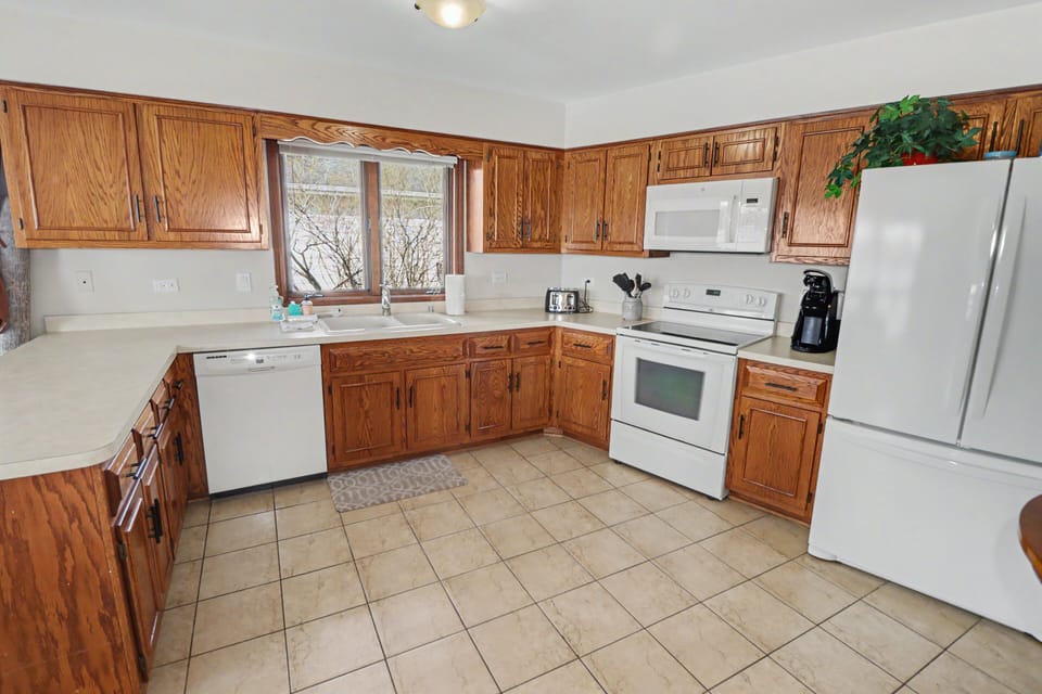 Kitchen with cookware, utensils & essential appliances
