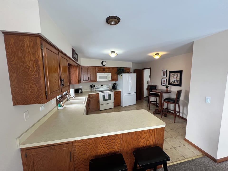 Kitchen with cookware, utensils & essential appliances