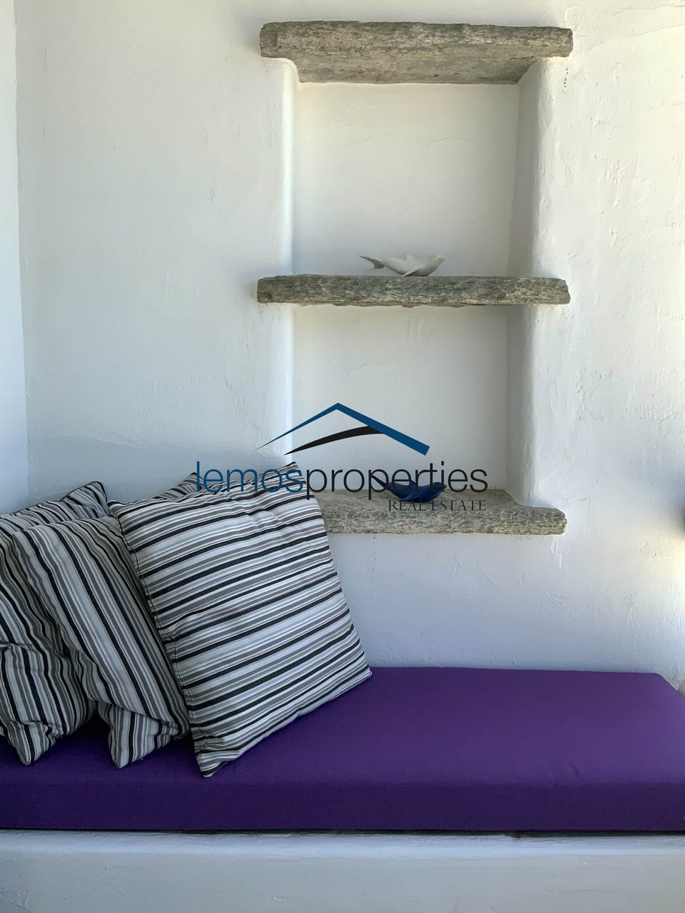 Comfortable love seat on the bedroom balcony