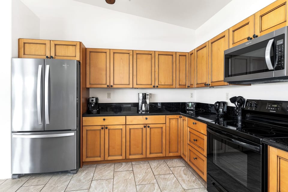 Whip up your favorite meals in this fully equipped kitchen, featuring stainless steel appliances, ample counter space, and everything you need to feel right at home.