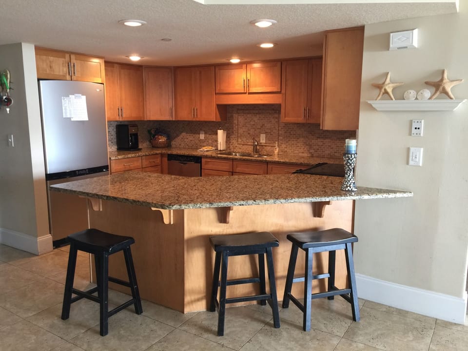 kitchen with granite counter tops and stainless steel appliances