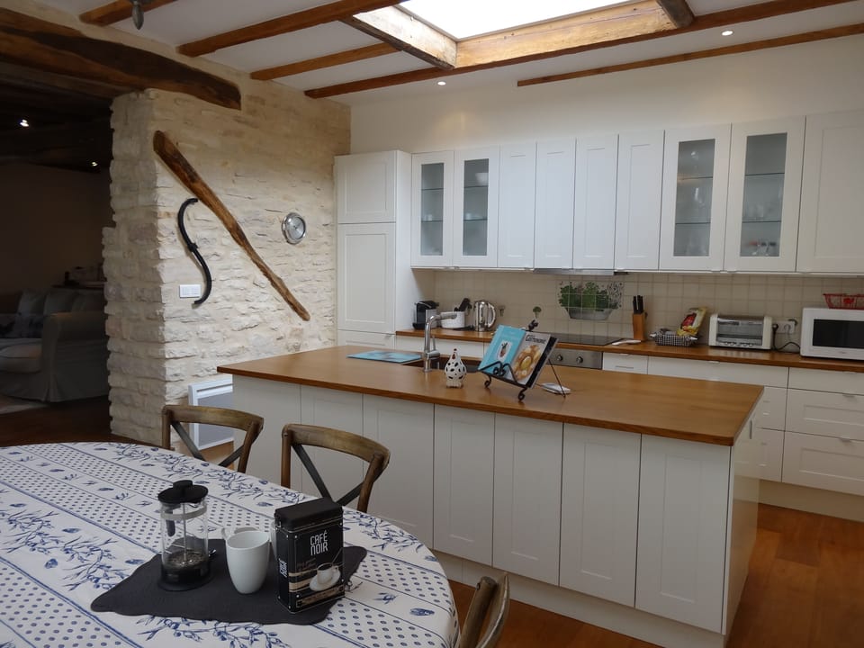 Awaiting your cooking expertise, fully equipped kitchen.