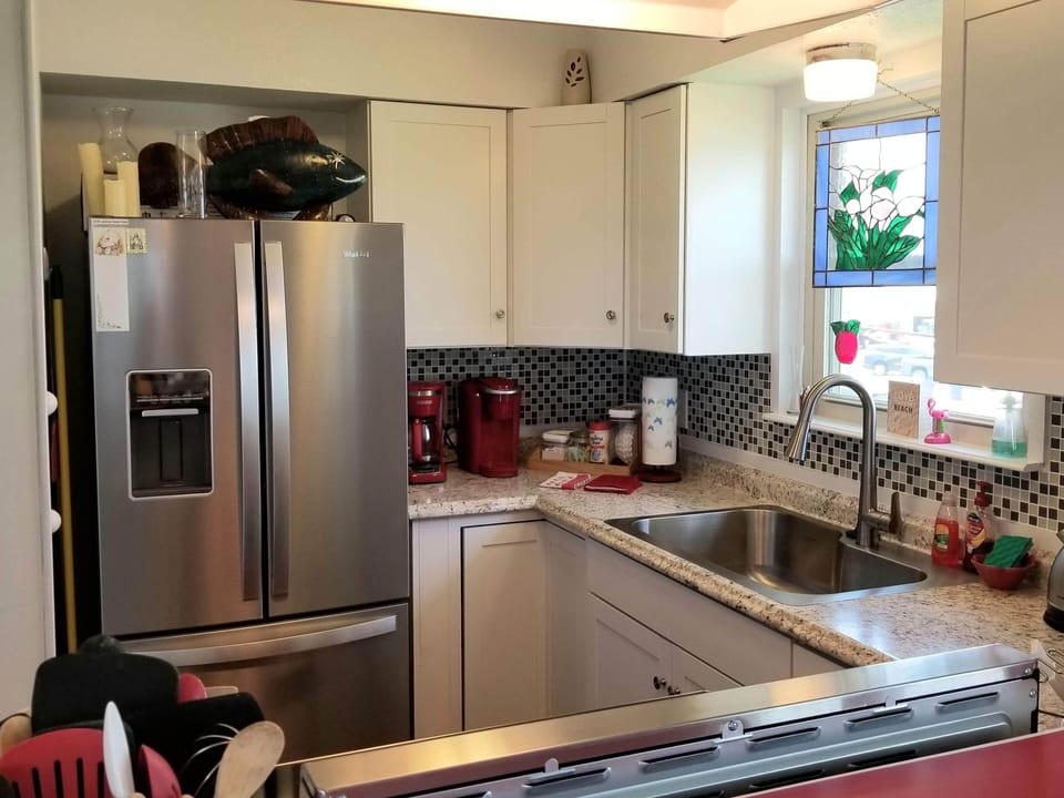 Appliances: coffee maker and Keurig. Blender, mixer, etc.. in lower cabinet.